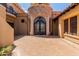 Ornate double iron doors in a stone entryway at 6215 E Turquoise Ave, Paradise Valley, AZ 85253