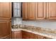 Well-appointed kitchen boasts ample cabinetry and granite countertops at 6215 E Turquoise Ave, Paradise Valley, AZ 85253
