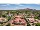 Impressive estate home with red tile roof, surrounded by lush landscaping at 6215 E Turquoise Ave, Paradise Valley, AZ 85253