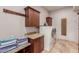 Laundry room with wood cabinets, granite countertops and a washer and dryer at 6215 E Turquoise Ave, Paradise Valley, AZ 85253