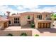 Luxury home with large yard, desert landscaping, and brick driveway at 6215 E Turquoise Ave, Paradise Valley, AZ 85253
