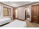 Bedroom with two twin beds and en-suite bathroom at 6215 E Turquoise Ave, Paradise Valley, AZ 85253