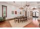 Spacious dining room with hardwood floors and an ornate chandelier at 6215 E Turquoise Ave, Paradise Valley, AZ 85253