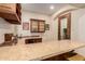 L-shaped wet bar with granite countertops at 6215 E Turquoise Ave, Paradise Valley, AZ 85253