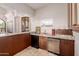 Wet bar with granite countertop and undercounter refrigerator at 6215 E Turquoise Ave, Paradise Valley, AZ 85253