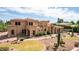 Luxury home with large yard, desert landscaping, and brick driveway at 6215 E Turquoise Ave, Paradise Valley, AZ 85253