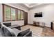 Relaxing sitting area with TV and sofa at 6215 E Turquoise Ave, Paradise Valley, AZ 85253