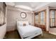 Bedroom with a queen-size bed and French doors to a balcony at 6215 E Turquoise Ave, Paradise Valley, AZ 85253
