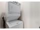 Stackable washer and dryer in a small laundry closet at 6215 E Turquoise Ave, Paradise Valley, AZ 85253