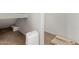 Unfinished basement with a portable air conditioner and storage at 6215 E Turquoise Ave, Paradise Valley, AZ 85253
