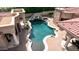 Freeform pool with waterfall feature and brick patio at 6215 E Turquoise Ave, Paradise Valley, AZ 85253