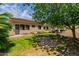Green lawn, mature trees, and a portion of the house are visible at 6215 E Turquoise Ave, Paradise Valley, AZ 85253