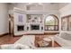 Living room featuring hardwood floors, a cozy sectional and a built-in entertainment center at 6215 E Turquoise Ave, Paradise Valley, AZ 85253