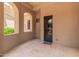 Covered patio with arched windows and seating area at 6215 E Turquoise Ave, Paradise Valley, AZ 85253