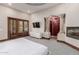 Main bedroom with fireplace, private access, and ensuite bath at 6215 E Turquoise Ave, Paradise Valley, AZ 85253