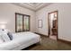Bedroom with a queen-size bed and access to bathroom at 6215 E Turquoise Ave, Paradise Valley, AZ 85253