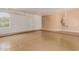 Two-car garage with a tan colored wall and white garage door at 6215 E Turquoise Ave, Paradise Valley, AZ 85253