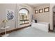 Comfortable bedroom with a daybed, large window, and pool view at 6215 E Turquoise Ave, Paradise Valley, AZ 85253