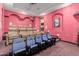 Home theater with reclining seats and projector at 6215 E Turquoise Ave, Paradise Valley, AZ 85253