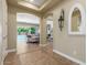 Bright entryway with tile flooring, views into living room and pool area at 20371 E Calle De Flores --, Queen Creek, AZ 85142