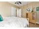 Spacious bedroom with a large bed and built-in dresser at 20371 E Calle De Flores --, Queen Creek, AZ 85142