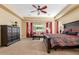 Main bedroom with large bed, dresser, and window seating at 20371 E Calle De Flores --, Queen Creek, AZ 85142