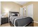 Cozy bedroom with striped bedding and nightstand at 20371 E Calle De Flores --, Queen Creek, AZ 85142