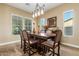 Formal dining room with dark wood table and chairs, neutral walls at 20371 E Calle De Flores --, Queen Creek, AZ 85142