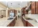Kitchen with granite countertops, stainless steel appliances, and ample cabinet space at 20371 E Calle De Flores --, Queen Creek, AZ 85142
