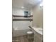 Bathroom with a bathtub, toilet and white vanity at 2303 W Marshall Ave, Phoenix, AZ 85015
