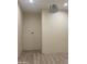 Spacious bedroom with wood-look floors and chandelier at 2303 W Marshall Ave, Phoenix, AZ 85015