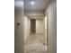 Long hallway with tile floors and light walls at 2303 W Marshall Ave, Phoenix, AZ 85015
