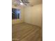 Simple bedroom with wood-look floors and a ceiling fan at 2303 W Marshall Ave, Phoenix, AZ 85015