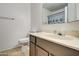 Bathroom with single sink vanity and toilet at 4443 W Solano S Dr, Glendale, AZ 85301
