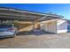 Covered parking with assigned spaces and a storage shed at 4443 W Solano S Dr, Glendale, AZ 85301