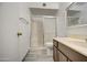 Clean bathroom with updated vanity, shower, and tile floors at 4443 W Solano S Dr, Glendale, AZ 85301