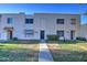 Two-story condo building with a walkway and landscaping at 4443 W Solano S Dr, Glendale, AZ 85301