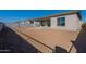 Large backyard with a view of the house and surrounding landscape at 16355 W Desert Mirage Dr, Surprise, AZ 85388