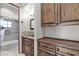 Bathroom with wood cabinets and granite countertop at 7260 E Eagle Crest Dr # 19, Mesa, AZ 85207