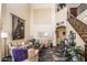 Spacious living room with high ceilings, a staircase and tiled floors at 16612 N 151St Ln, Surprise, AZ 85374