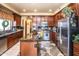 Spacious kitchen boasts granite countertops and stainless steel appliances at 16612 N 151St Ln, Surprise, AZ 85374