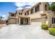Two-story house with a three car garage and curb appeal at 16612 N 151St Ln, Surprise, AZ 85374