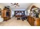 Primary bedroom with a king-size bed, sitting area, and large windows at 16612 N 151St Ln, Surprise, AZ 85374