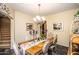 Bright dining room with a view of the kitchen and staircase at 16612 N 151St Ln, Surprise, AZ 85374