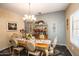Formal dining room featuring a chandelier and ornate furniture at 16612 N 151St Ln, Surprise, AZ 85374