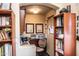 Convenient home office with ample built-in shelving and workspace at 16612 N 151St Ln, Surprise, AZ 85374