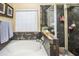 Relaxing bathroom with a large soaking tub, shower, and tile details at 16612 N 151St Ln, Surprise, AZ 85374