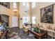Bright living room with high ceilings, hardwood floors and a staircase at 16612 N 151St Ln, Surprise, AZ 85374