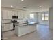 Modern kitchen with white cabinets, gray countertops, and island at 5612 W Paseo Way, Laveen, AZ 85339