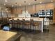 Modern community kitchen with island and bar stools at 3300 E Broadway, Rd # 148, Mesa, AZ 85204